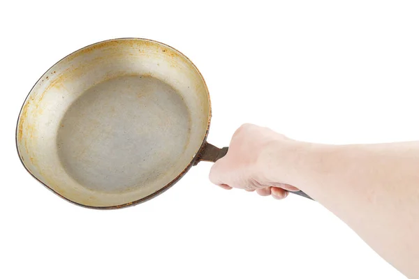 Bare caucasian hand holding empty old aluminium frying pan — Stock Photo, Image