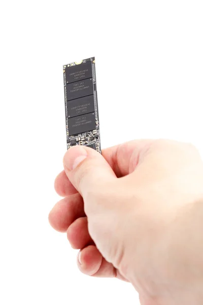 Kaukasische hand houden NVME M.2 SSD 2280 3Dnand SLC drive stick geïsoleerd op wit — Stockfoto