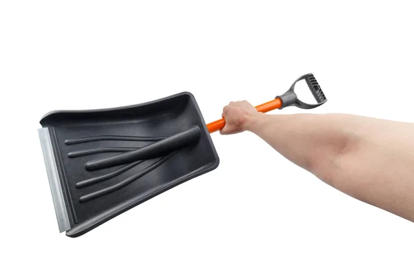 Witte hand met kleine zwarte plastic sneeuwschuiver, geïsoleerd — Stockfoto