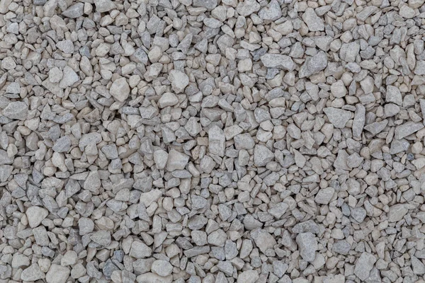 Zavorra calcarea bianca asciutta fondo pieno telaio piatto. Piccola texture macadam grigio polveroso rotto pietre. — Foto Stock