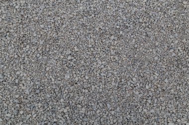 Beyaz kireçtaşı balast düz çerçeve arka plan. Küçük gri tozlu kırılan makadam taşı dokusu..