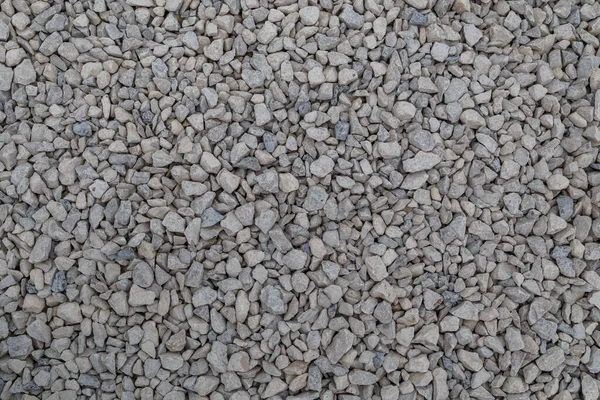 Zavorra calcarea bianca asciutta fondo pieno telaio piatto. Piccola texture macadam grigio polveroso rotto pietre. — Foto Stock