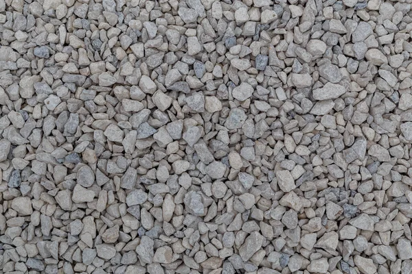 Dry white limestone ballast flat full frame background. Small gray dusty broken macadam stones texture. — Stock Photo, Image