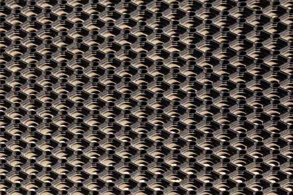 Textura a pozadí použité zaprášené buněčné pryžové podlahové rohože — Stock fotografie