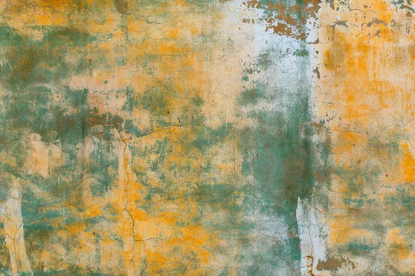 Shabby weathered artistically peeled off yellow and green paint — Stock Photo, Image
