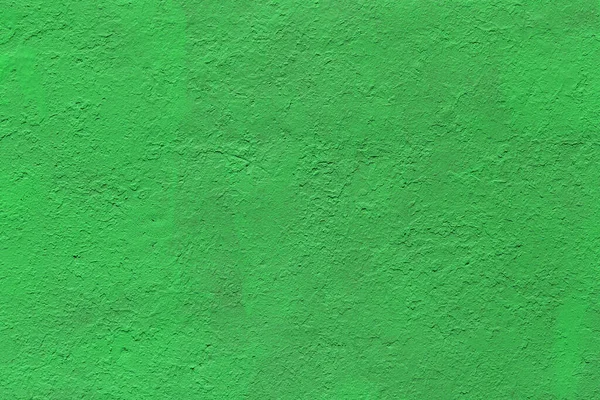 Latar belakang dan tekstur tebal datar dicat permukaan hijau matte di bawah sinar matahari langsung — Stok Foto