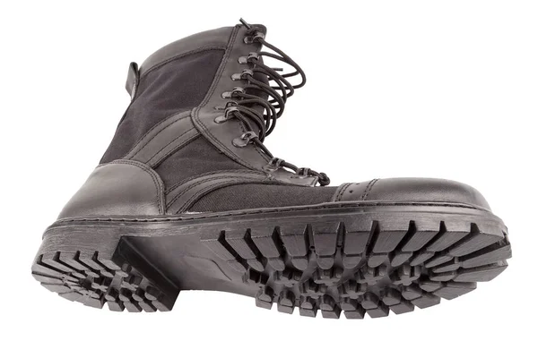 Nova bota militar leve preto isolado no fundo branco, deitado ao seu lado — Fotografia de Stock