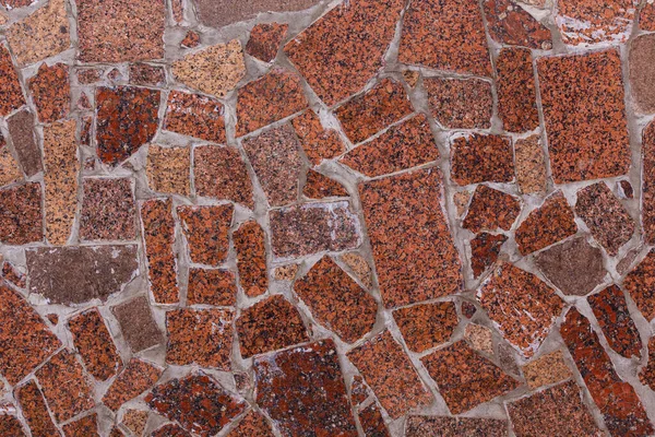 Abstracto textura plana y fondo de piezas de granito rojo mosaico — Foto de Stock