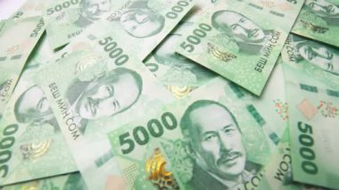 rotating background of new 5000 Kyrgyzstani Som banknotes, closeup full-frame background