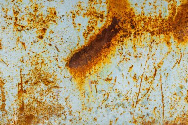 Light white metal surface showing prominent long dent with rust streaks and scratches