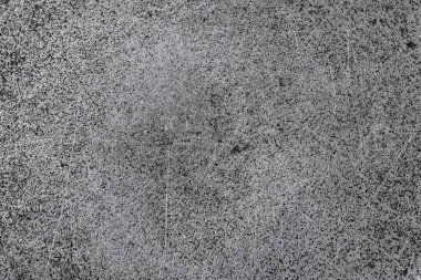 flat cast iron surface with scratches and black stains - full-frame background and texture