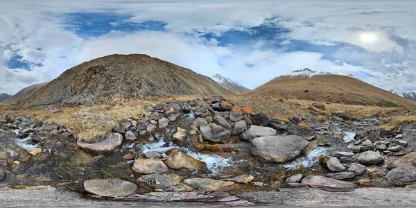 A 360 by 180 degrees equirectangular panorama of Mountain river with rocks at springtime in mountain gorge at sunny afternoon