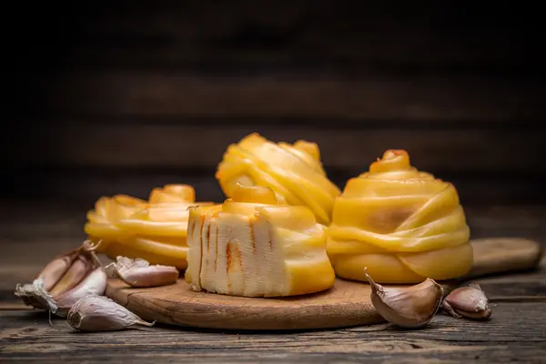 Twisted handicraft cheese — Stock Photo, Image