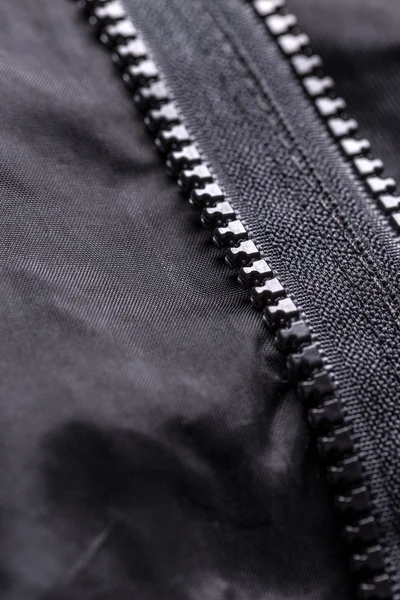 Zipper on black material — Stock Photo, Image