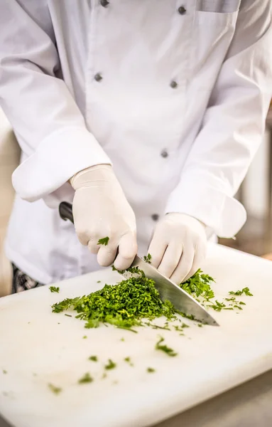 Chef chopping parsley leaves — Stock Photo, Image