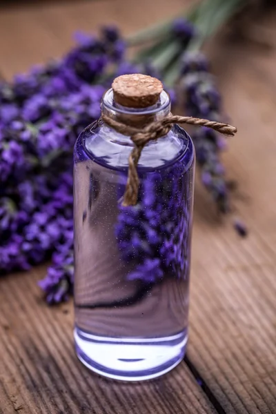 Lavender oil in a glass bottle — Stock Photo, Image