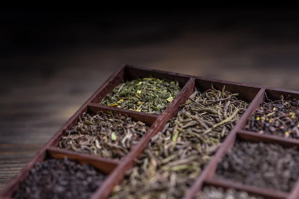 Dry tea in wooden box — Stock Photo, Image