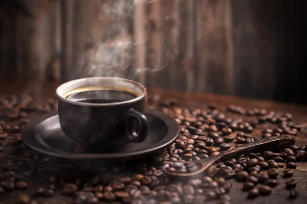 Koffiekopje en bonen — Stockfoto