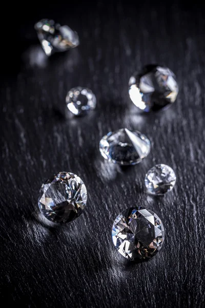 Shiny diamonds on dark background — Stock Photo, Image