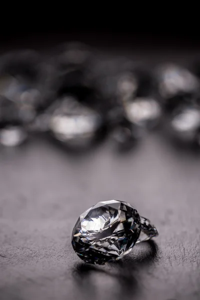 Shiny diamond on dark background — Stock Photo, Image