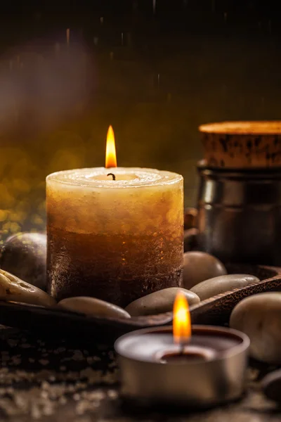 Burning candles and stones — Stock Photo, Image