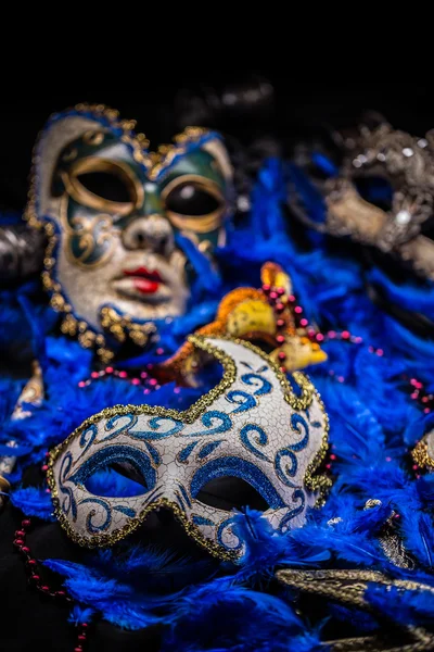 Carnival mask on blue feather — Stock Photo, Image