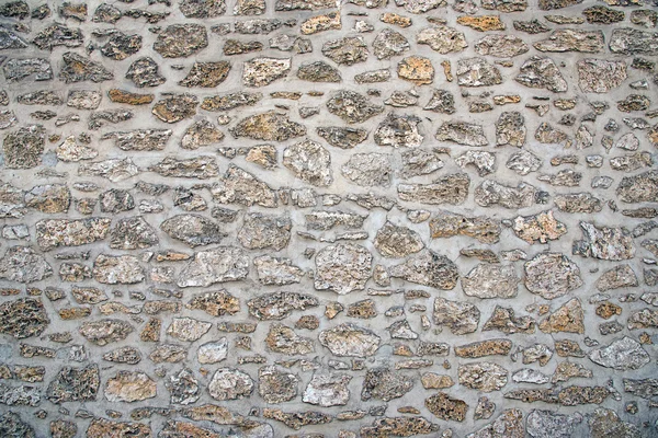 Antiguo muro de piedra natural — Foto de Stock