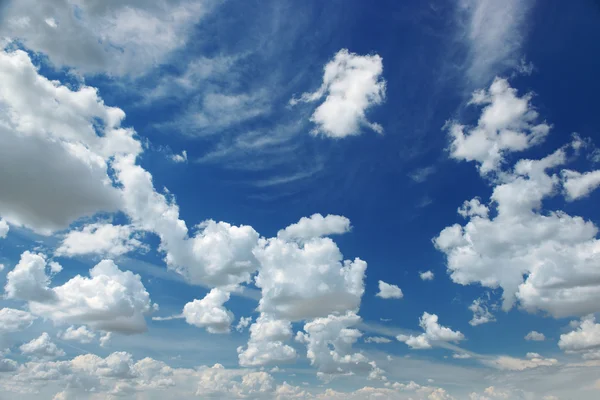 White fluffy clouds on sky Stock Picture