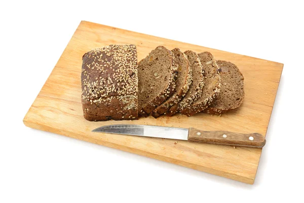 Cut bread on breadboard — Stock Photo, Image