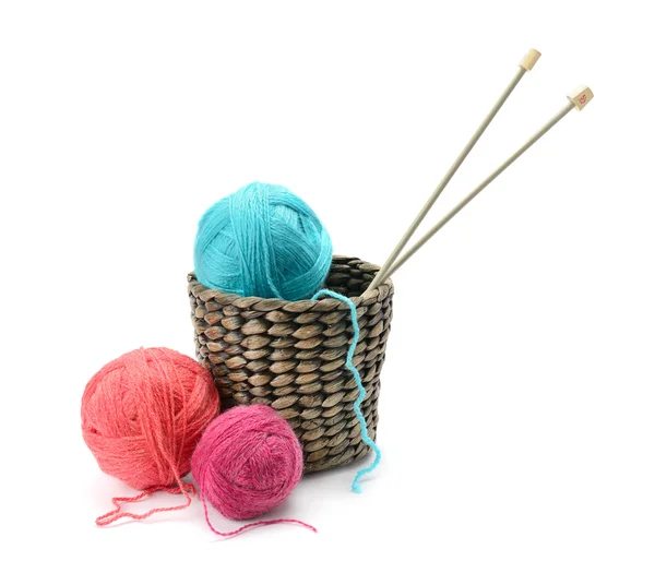 Multicolored balls and needles in basket — Stock Photo, Image