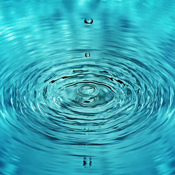 drop of water falls into water