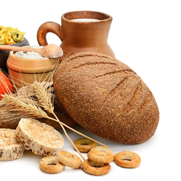 Composition of bread, milk, vegetables — Stock Photo, Image