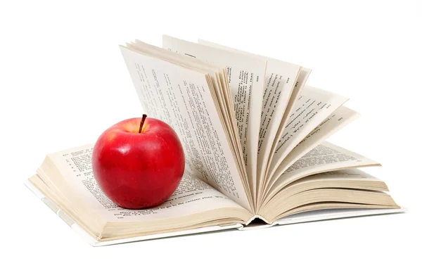 Manzana roja en un libro —  Fotos de Stock