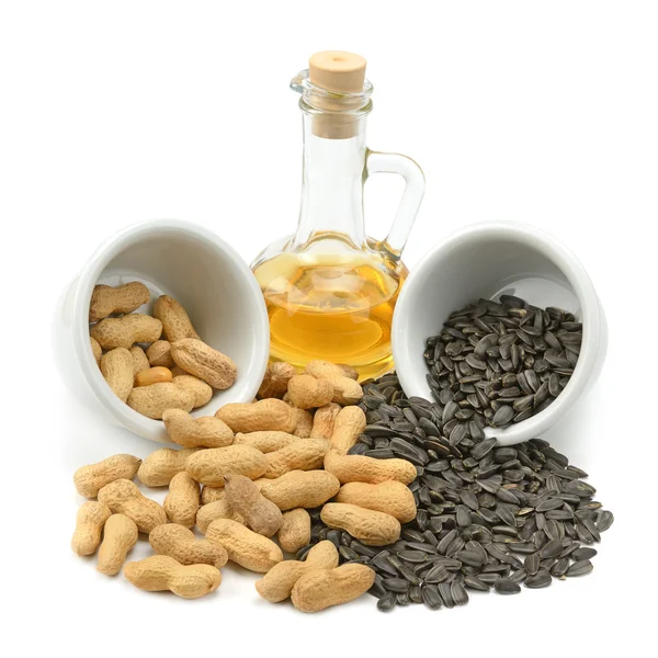 Sementes de girassol, amendoim e óleo — Fotografia de Stock