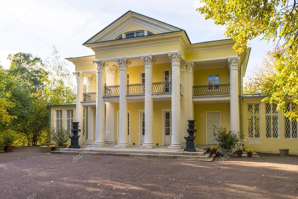 Ancient manor with columns in the autumn park