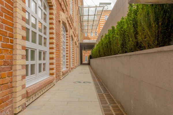 Facade of an old office building of red brick — Stock Photo, Image