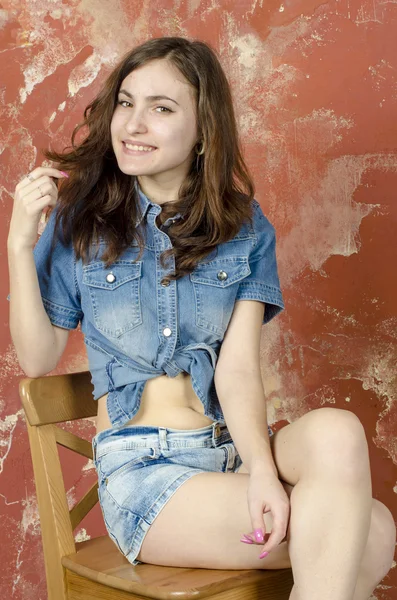 Cheerful young teen girl in denim shorts — Stock Photo, Image