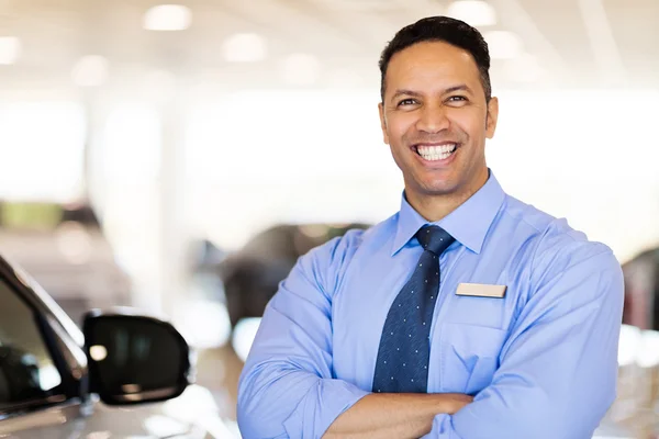 Salesman standing in showroom — Stock Photo, Image