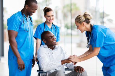 doctors greeting disabled patient clipart
