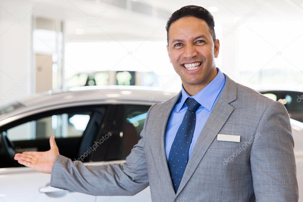 car dealer presenting new vehicle