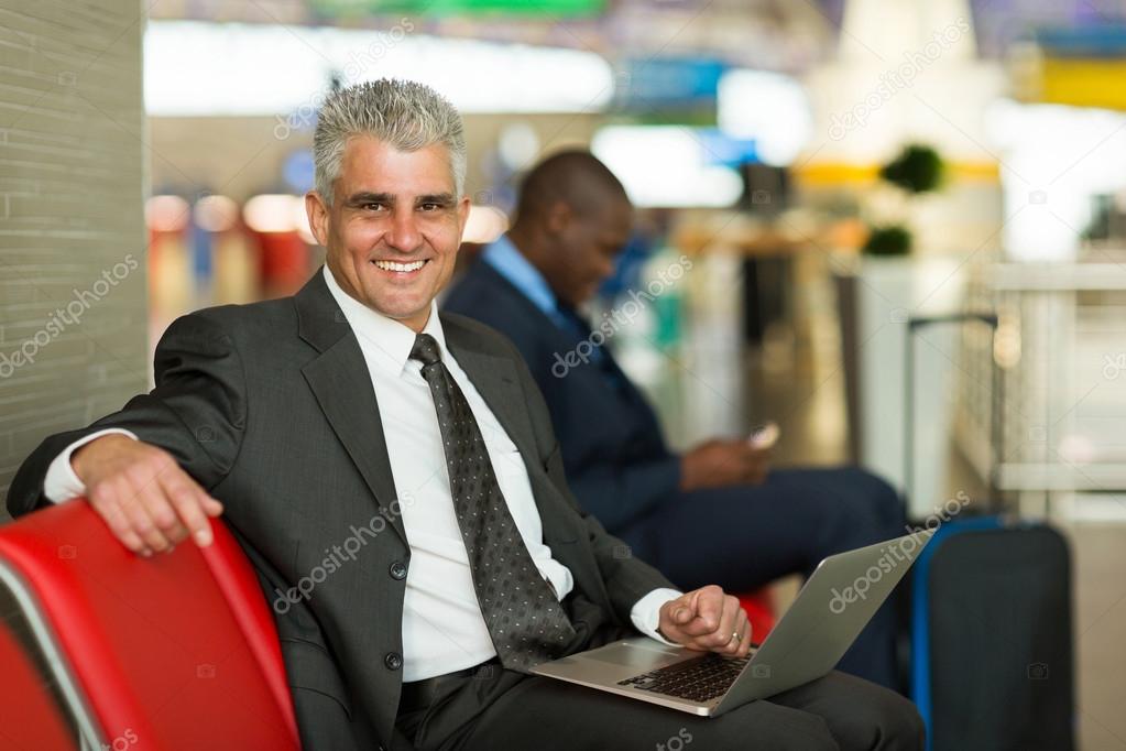 Business traveler using laptop