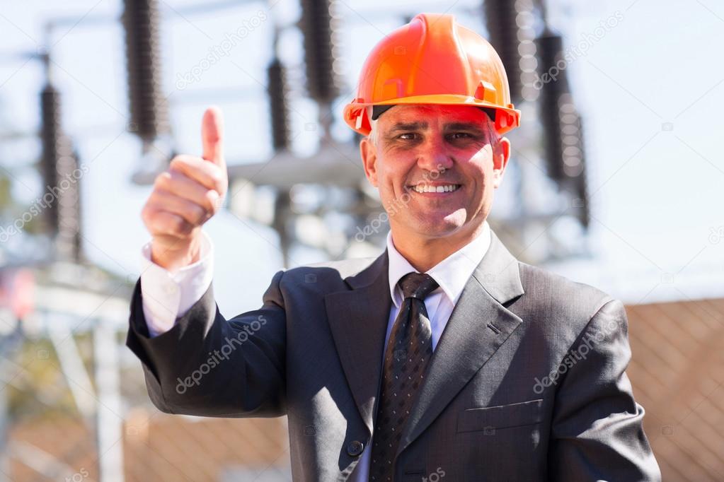 Middle-aged manager giving thumb up