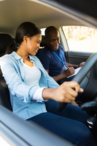 African girl and driving instructor — Stock Photo, Image