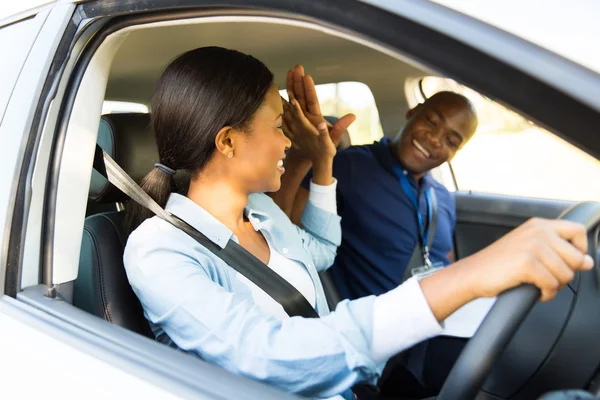 Student driver and instructor high five — Stock Photo, Image