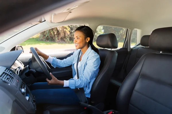 African woman driving a car — Stock Photo, Image