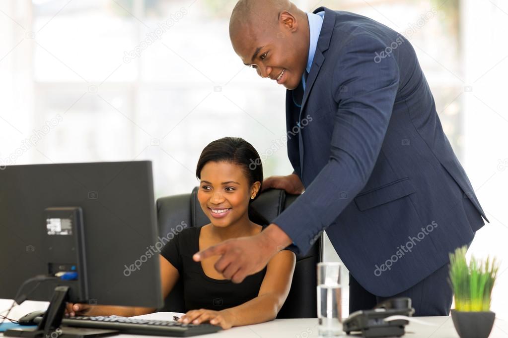 African boss guiding his employee