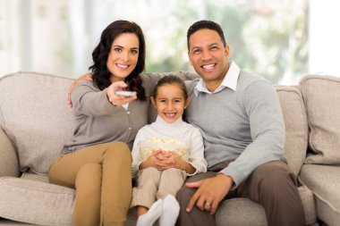 Young family watching tv