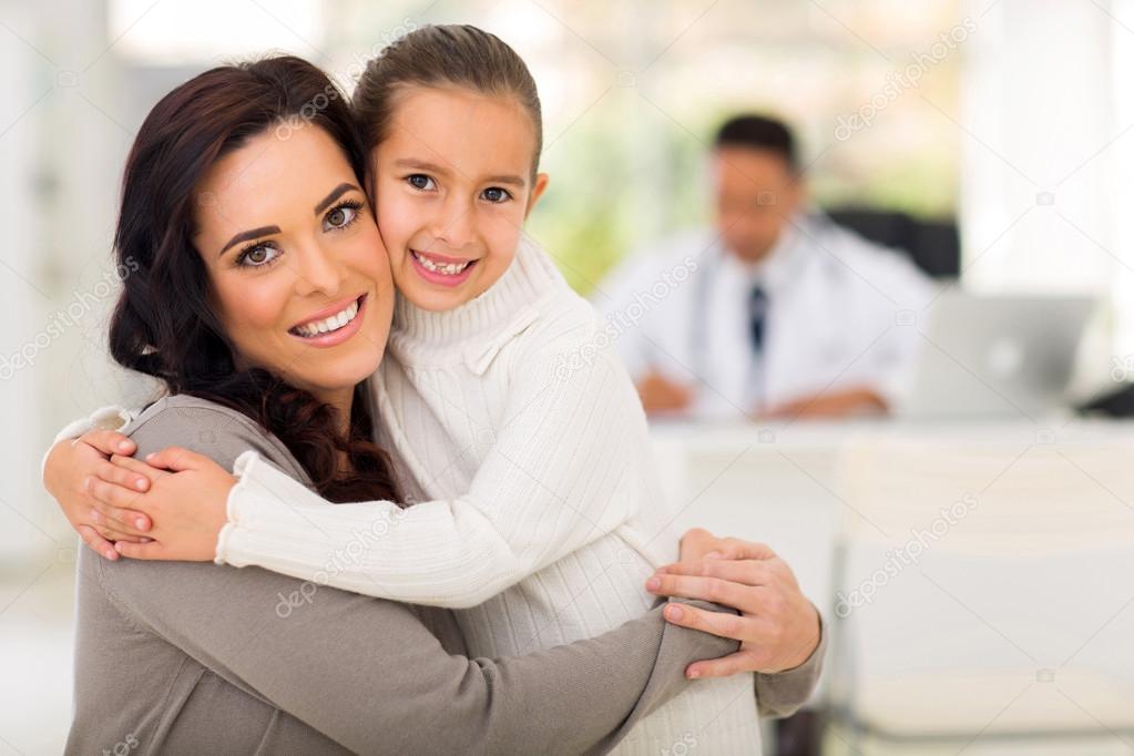 Mother and daughter hugging