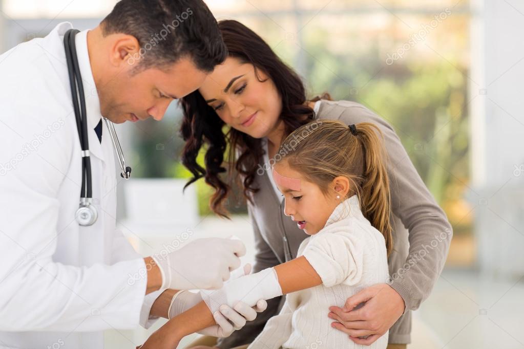 Doctor bandaging patient