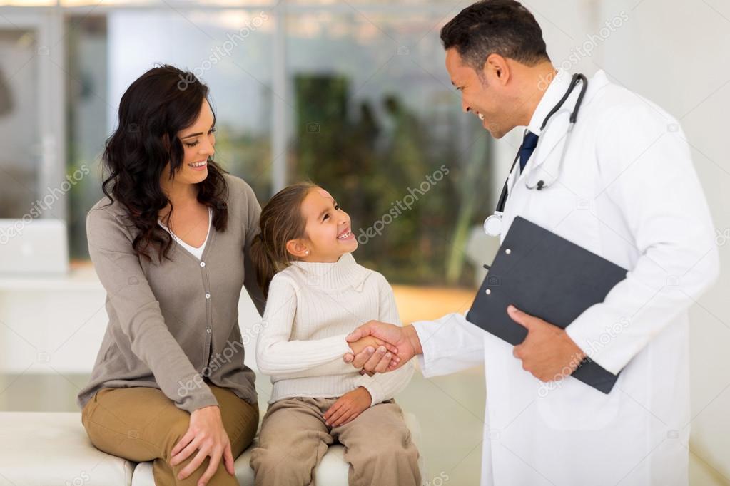 Pediatrician handshaking with little patient